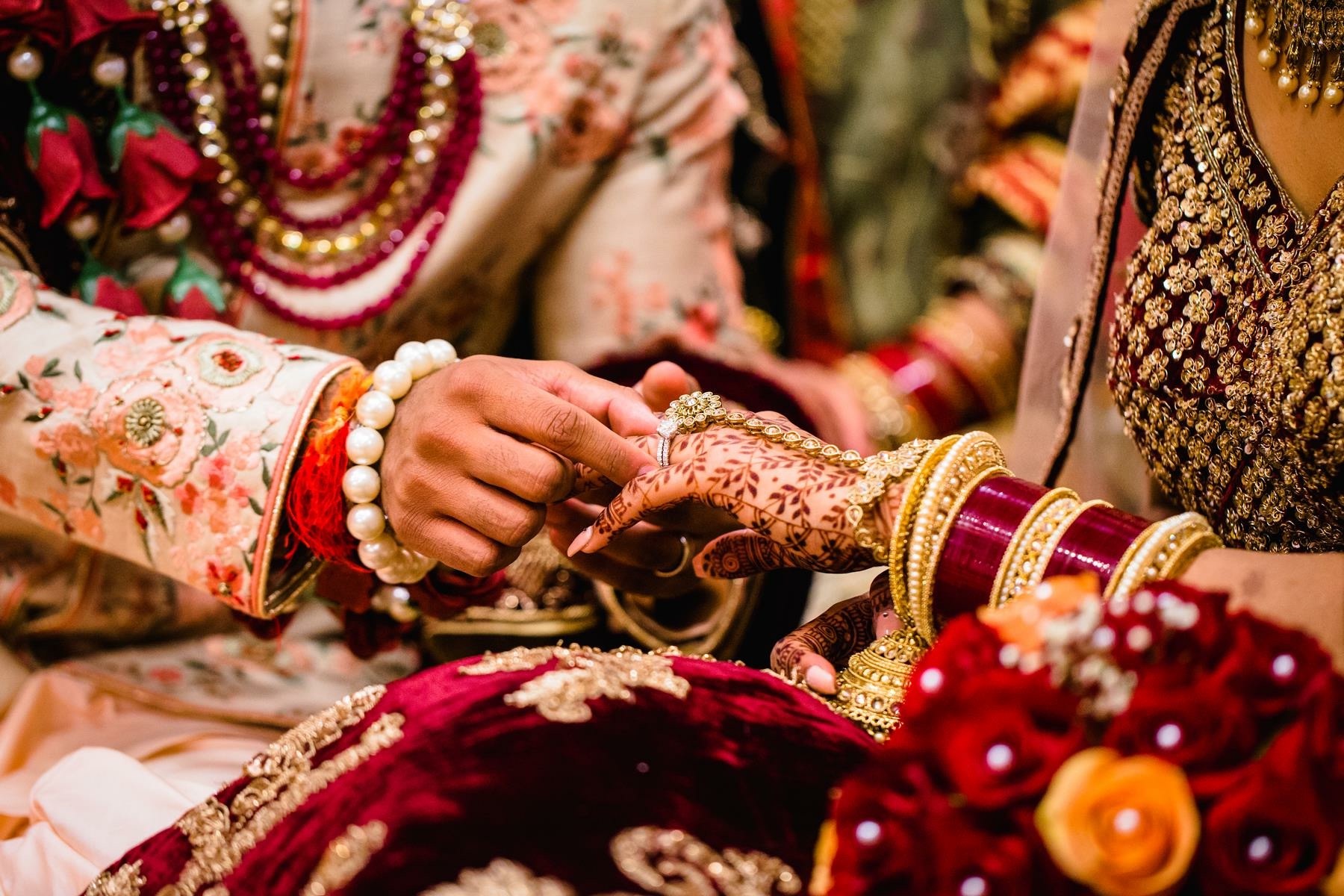 Close-up of a couple exchanging rings during the ceremony